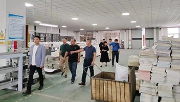 江苏人民出版社调研指导新华企业教材印制工作